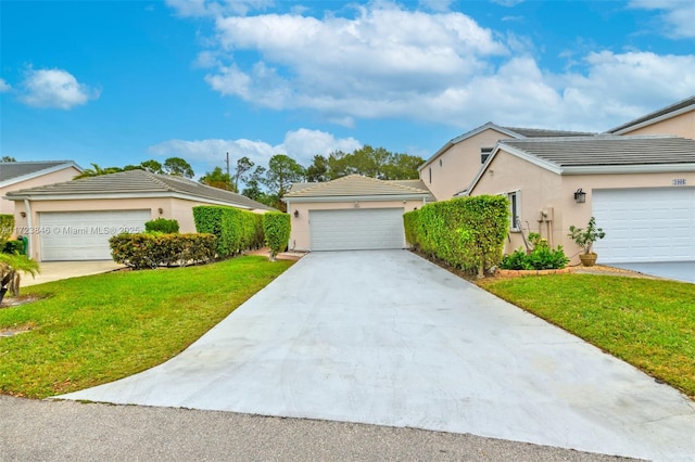 single story home with a front yard and a garage