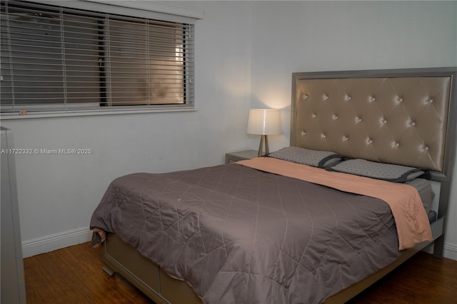 bedroom featuring dark wood-type flooring