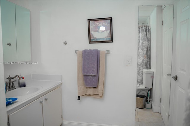 bathroom with tile patterned floors and vanity