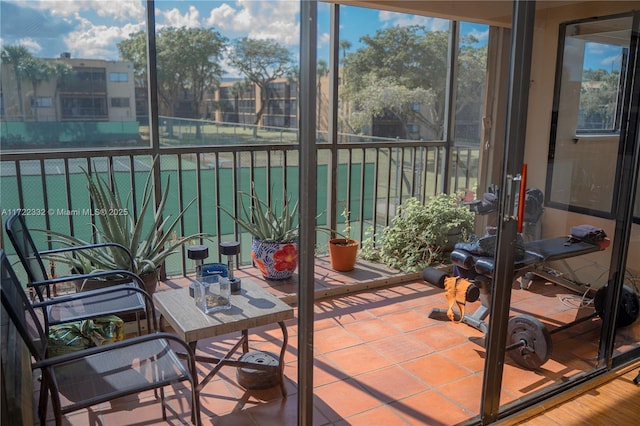 sunroom / solarium featuring plenty of natural light