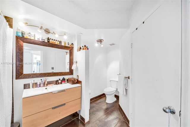 1330 W Ave Unit 1904, Miami Beach, FL 33139 - full bath with toilet, vanity, tile patterned floors, and baseboards