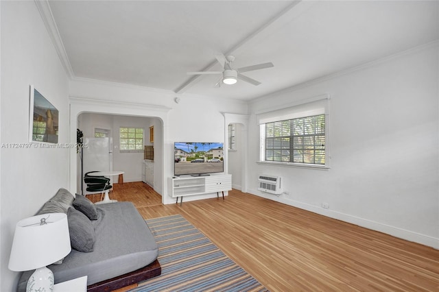 interior space with crown molding, ceiling fan, a wall mounted air conditioner, and hardwood / wood-style floors