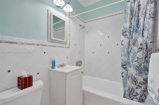 full bathroom with tile walls, vanity, shower / bath combination with curtain, and toilet