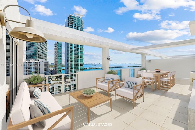 view of patio / terrace featuring a water view and an outdoor hangout area