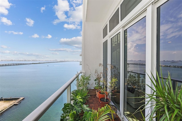 balcony featuring a water view