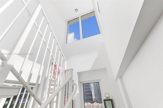 interior space featuring a towering ceiling