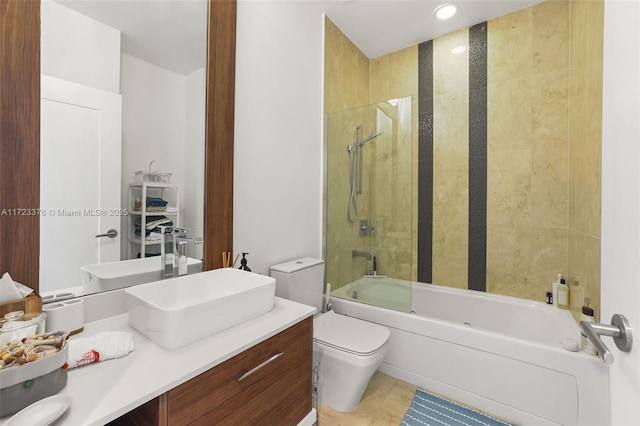 full bathroom featuring tile patterned flooring, shower / bath combination, vanity, and toilet