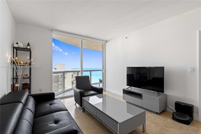 living room with baseboards and floor to ceiling windows