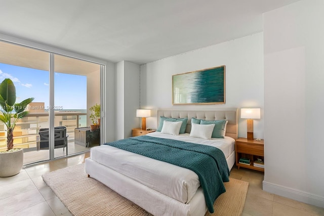 bedroom with access to exterior, expansive windows, light tile patterned flooring, and baseboards