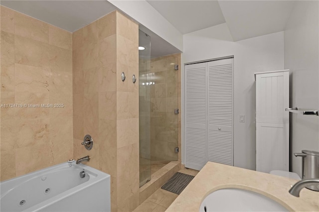 full bath with a whirlpool tub, tile patterned flooring, a shower stall, a closet, and vanity