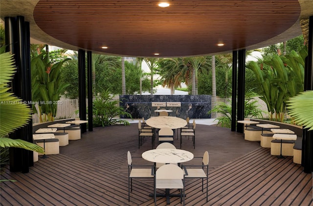 wooden terrace featuring outdoor dining area and fence