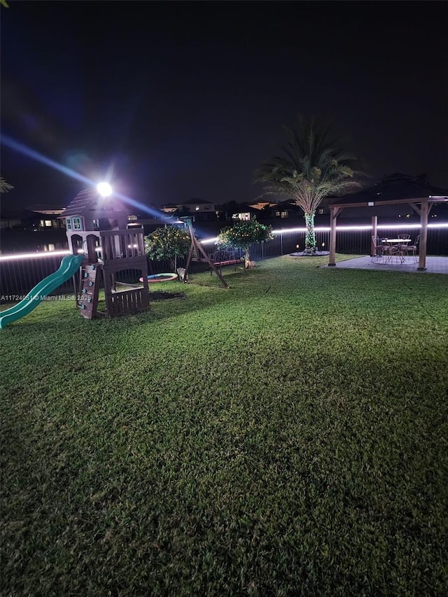 yard at twilight with a playground