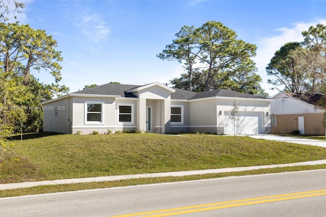 view of front facade featuring a front lawn and a garage