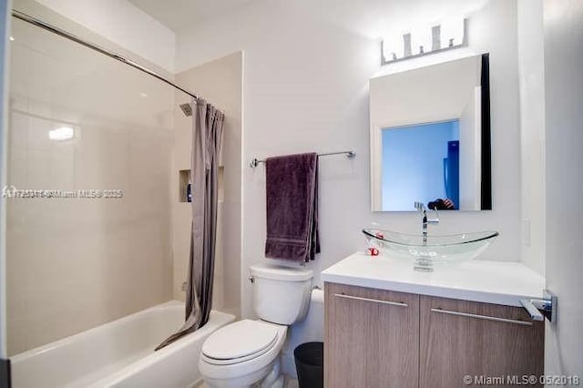 full bathroom with vanity, toilet, and shower / bath combo