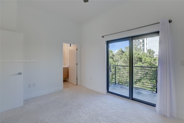 empty room featuring light colored carpet