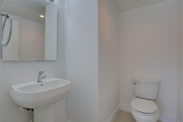 bathroom with sink and toilet