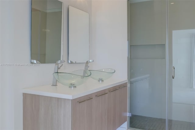 bathroom with vanity and walk in shower