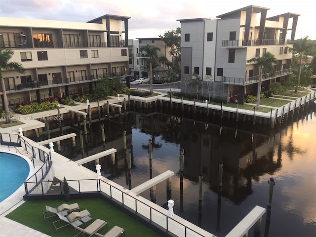 view of pool featuring a water view