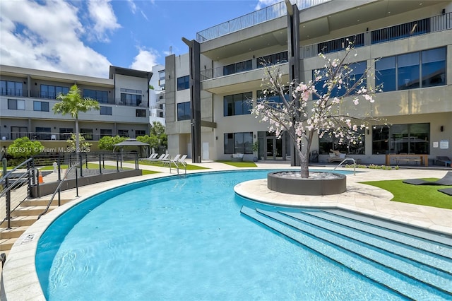 view of swimming pool featuring a patio