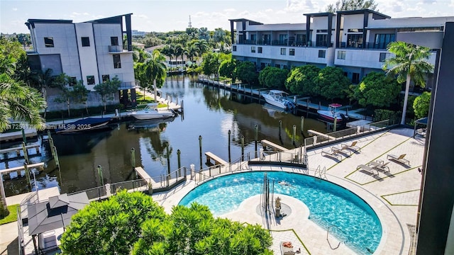 view of pool featuring a water view