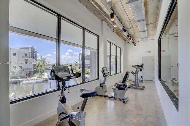 gym featuring a water view