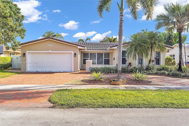 view of front of home with a garage