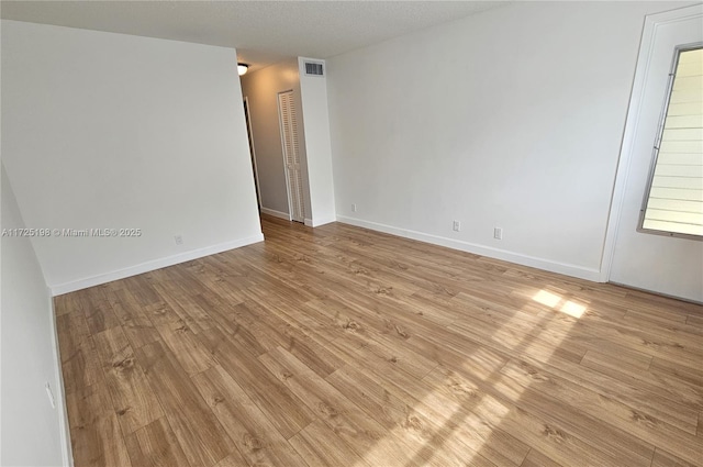 1000 NE 14th Ave Unit 404, Hallandale Beach, FL 33009 - unfurnished room featuring light wood finished floors and baseboards