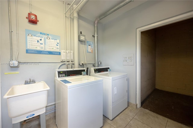 1000 NE 14th Ave Unit 404, Hallandale Beach, FL 33009 - community laundry room with washing machine and dryer and light tile patterned floors