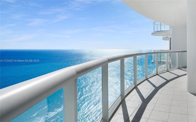 balcony featuring a water view