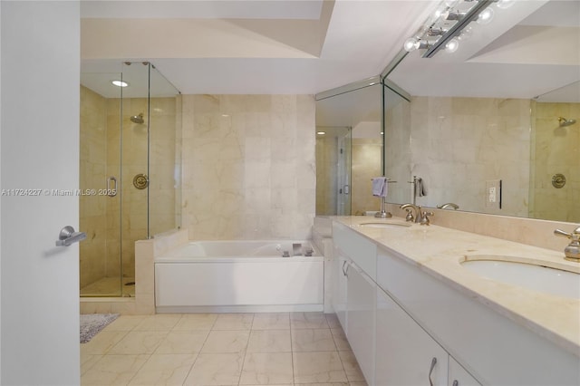 bathroom with tile walls, plus walk in shower, and vanity