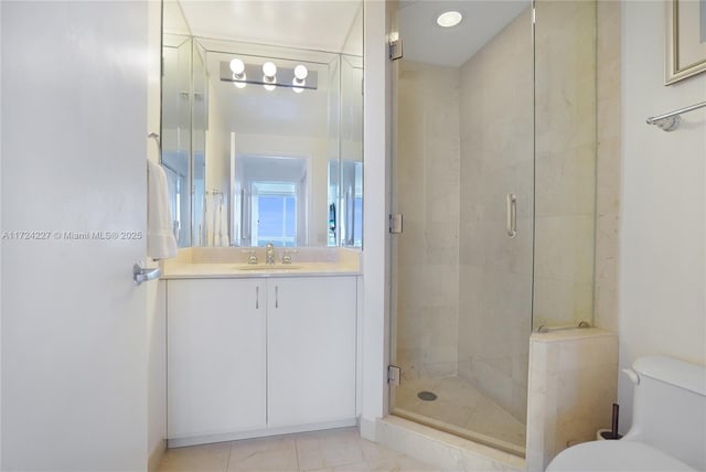 bathroom with toilet, an enclosed shower, tile patterned floors, and vanity