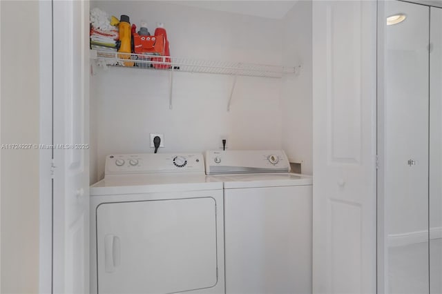 laundry room featuring separate washer and dryer