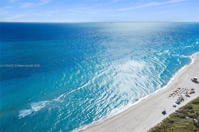 bird's eye view featuring a beach view and a water view