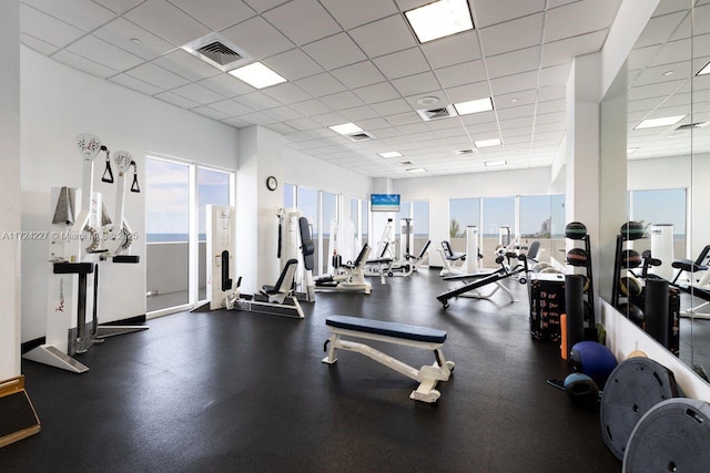 workout area with a paneled ceiling