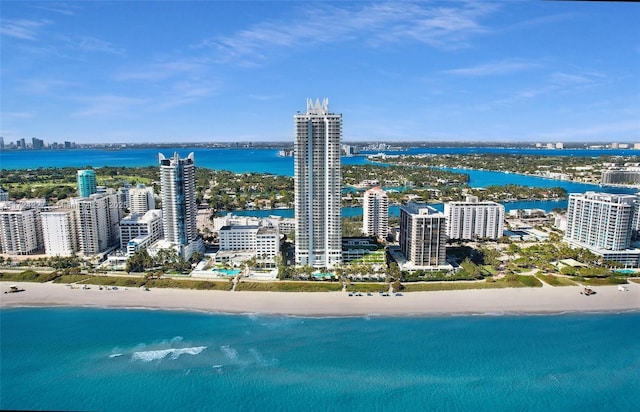 drone / aerial view with a beach view and a water view