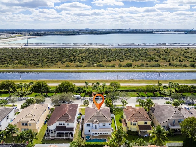 birds eye view of property featuring a water view