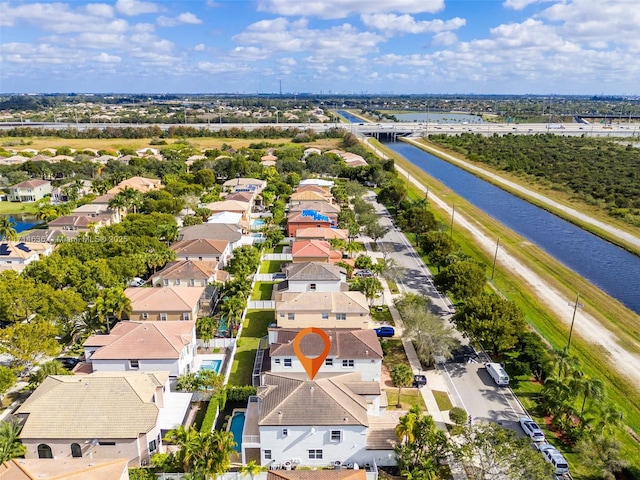 birds eye view of property featuring a water view