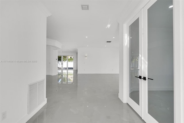 hall with ornamental molding and french doors