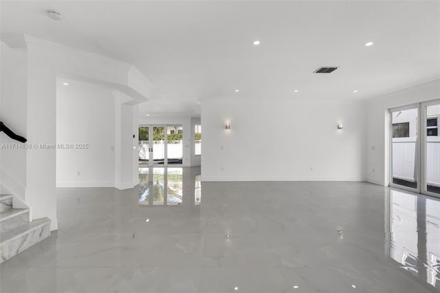 spare room with french doors and crown molding