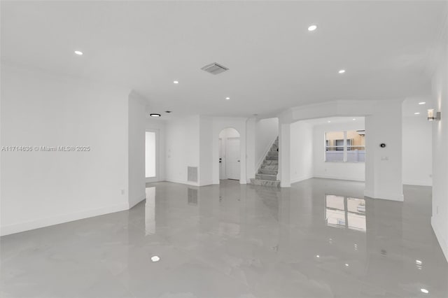 empty room featuring crown molding