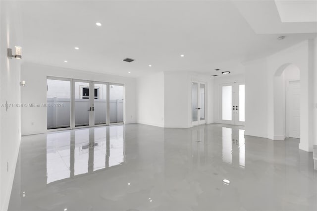 spare room with french doors and crown molding