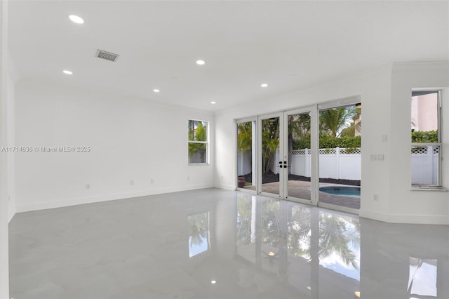 empty room featuring ornamental molding and french doors