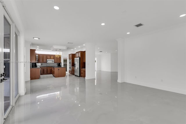 unfurnished living room featuring ornamental molding