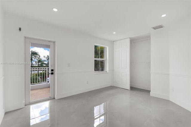 unfurnished room featuring a healthy amount of sunlight