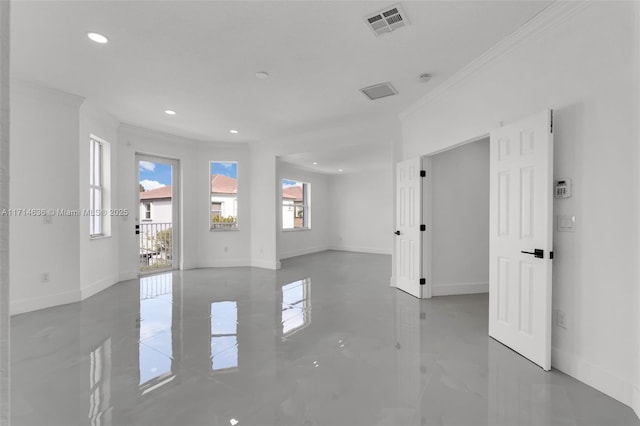 spare room featuring crown molding