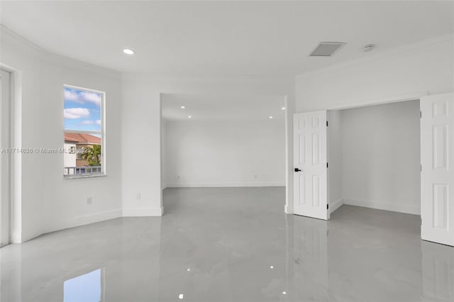 unfurnished room featuring crown molding