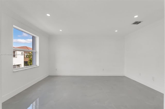 unfurnished room with ornamental molding