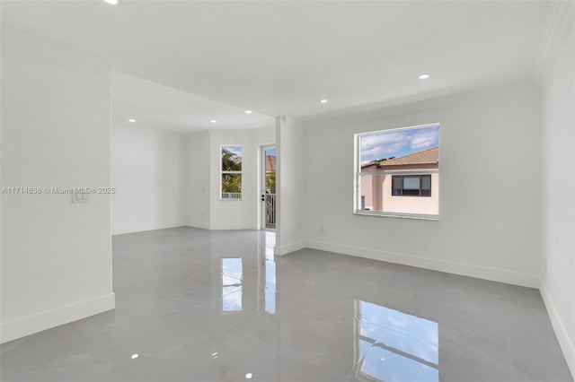 spare room with crown molding