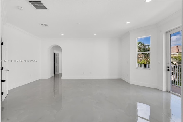 empty room featuring ornamental molding and concrete flooring