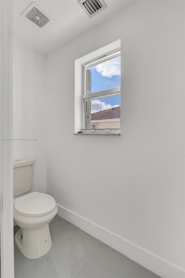 bathroom featuring toilet